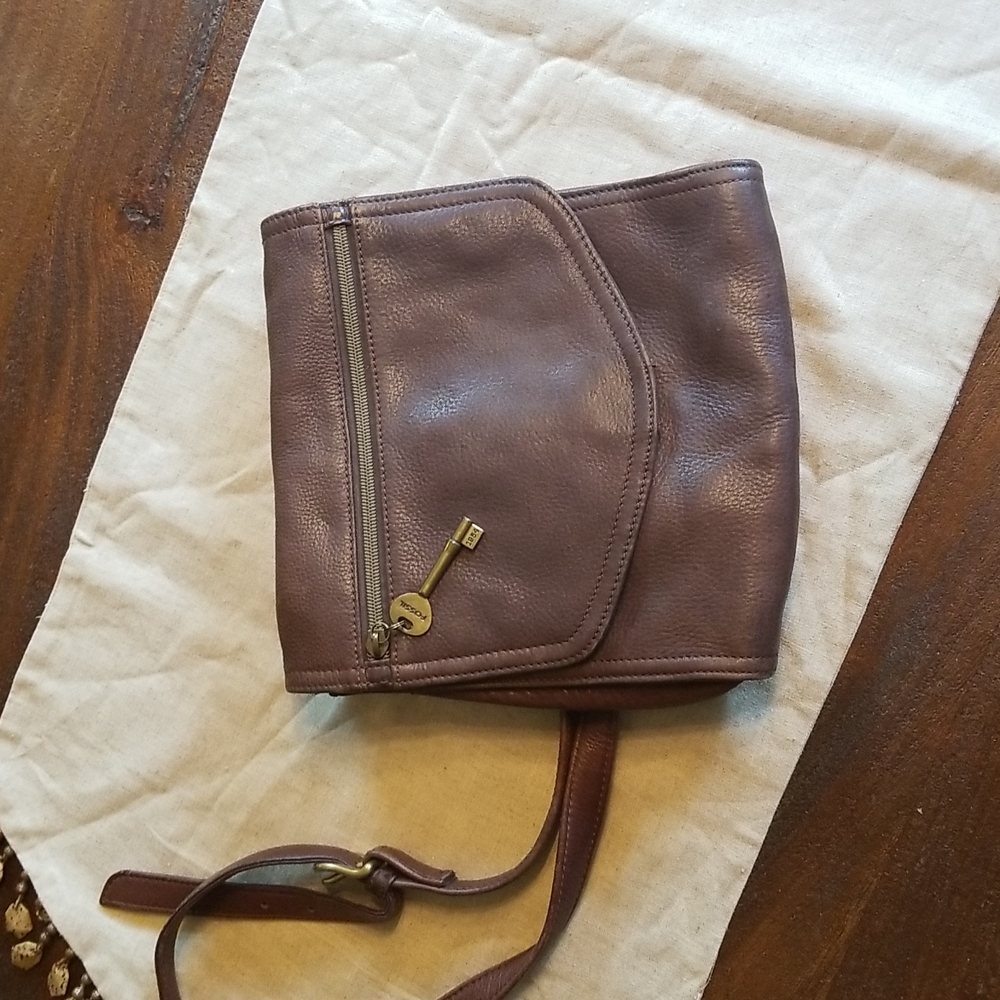 Leather Fossil bag with strap.